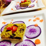 Sauerkraut Quiche with sun dried Tomatoes and sliced purple daikon, sprinkled with carrot confetti. *raw, vegan and gluten free*